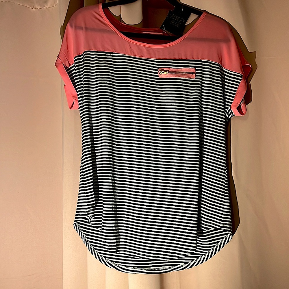 This is a Ashley Blue, black and white striped shirt with blush pink accents!